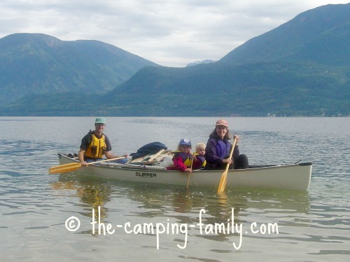 family and gear in canoe